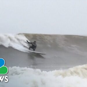 Surfers brave 33-degree Fahrenheit waters to catch waves on Lake Superior