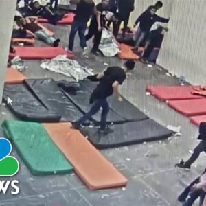 Questions grow after surveillance video shows deadly migrant center fire