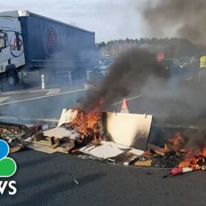 Protesters block French highway, garbage depot over pension reforms