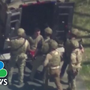 Prosecutors say intel leaks suspect poses flight risk