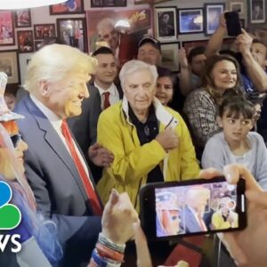 Trump takes photo with Jan. 6 defendant during campaign stop